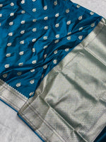 Peacock Blue banarasi Mashru Katan Silk Saree featuring zari butti work and heavy woven pallu.