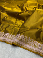 Olive green banarasi Mashru Katan Silk Saree featuring zari butti work and heavy woven pallu.